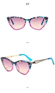Detailed view of cat-eye sunglasses featuring blue and purple frames with gold hinges