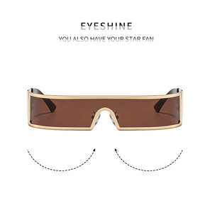 Detailaufnahme der goldenen Metallfassung und braunen Monoscheibe dieser futuristischen Brille