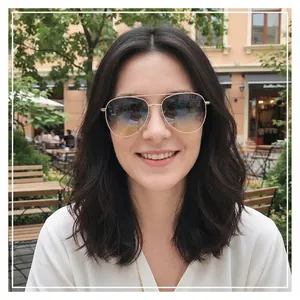 Classic gold double-bridge aviator sunglasses with brown gradient lenses on model