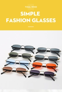 Detailed grid of rectangle metal sunglasses in various lens colors on white fabric