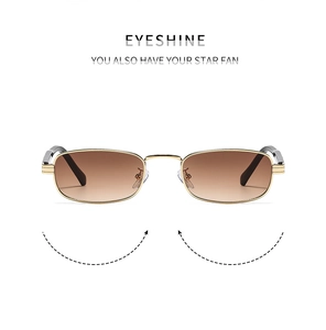 Detail of square gold metal frame sunglasses with gradient tea lenses and nose pads