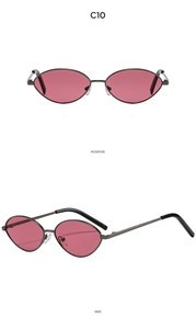 Detail view of oval metal sunglasses with dark red lenses and adjustable nose pads