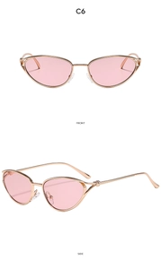 Detail view of pink cat-eye sunglasses with rose gold frames and metal knot accents