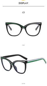 Detail der Cat-Eye-Brille mit grün-weiß gestreiften Akzenten an Bügeln und Rahmen
