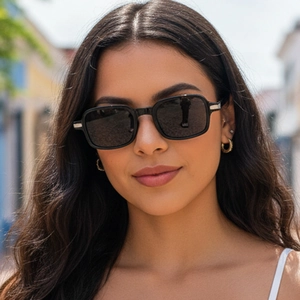 Modern vintage square frame sunglasses with metal accents on a female model outdoors