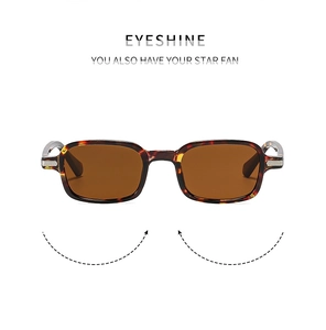 Detailed close-up of retro tortoiseshell sunglasses frames with metal stripe accents