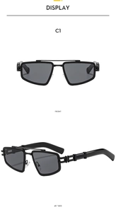 Detail view of black geometric square sunglasses with decorative temples and grey lenses