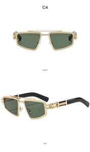 Detail view of gold square sunglasses with cutout metal temples and dark green lenses