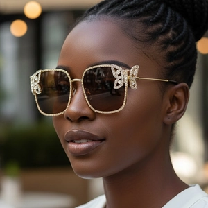 Chic oversized metal sunglasses with sparkling diamond butterfly accents and gradient lenses