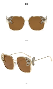 Detailed front and side view of square metal sunglasses with crystal butterfly decor