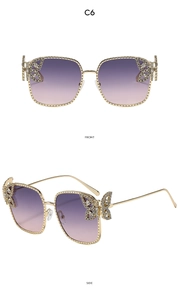 Detail view of square metal sunglasses with purple gradient lenses and butterfly diamond accents