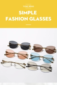 Flat lay of rimless butterfly sunglasses in six colors with gold metal frames