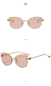 Detail view of pink rimless wavy edge sunglasses with gold temples in C3 colorway