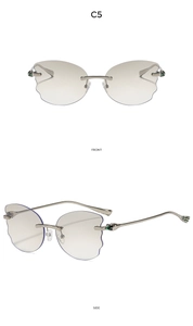 Front and side views of rimless irregular butterfly sunglasses with wavy grey lenses