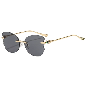Fashionable rimless sunglasses with grey wavy edges and gold metal temples on white background