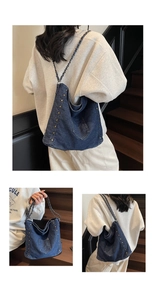 Close-up of retro denim tote bag featuring gold rivet accents and chain-woven strap