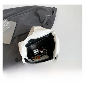 Internal view of the white large capacity tote bag showing spacious room for essentials