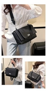Detail of black lychee grain leather crossbody bag featuring silver turn-lock and dual straps