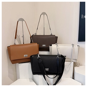 Litchi pattern faux leather tote bags in four colors with dual strap options and twist lock