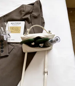 Detailed interior of a white quilted crossbody bag showing spacious storage for essentials