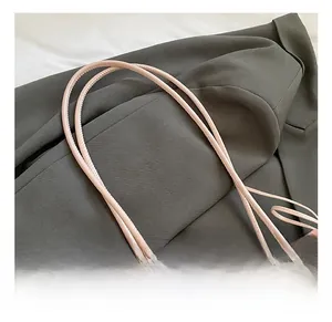 Detail of pink leopard print tote bag featuring sleek dual faux leather shoulder straps