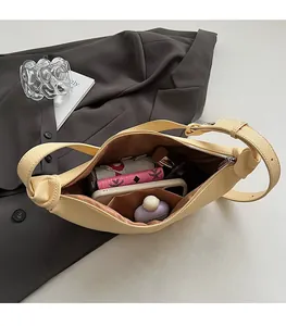 Top view of beige large crescent bag interior showing spacious capacity for daily essentials