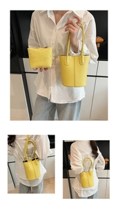 Detailed view of yellow lychee texture bucket bag with matching inner pouch