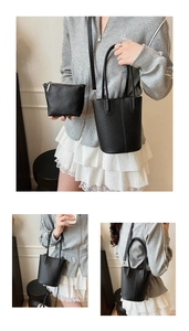 Detail of black lychee grain bucket bag set with silver hardware and red lining
