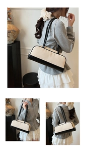 Detail of contrast weave shoulder bag with black leather trim and long handles