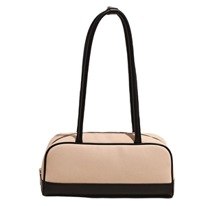 Minimalist beige canvas and black leather boston bag with long shoulder handles