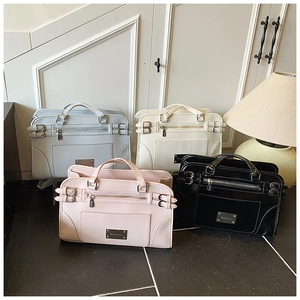Detail view of large capacity PU leather handbags in blue, white, pink and black colors