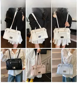 Detail view of large capacity PU leather shoulder bags in white, black, pink and blue colors