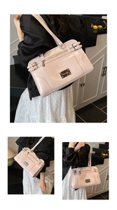 Detailed close-up of pale pink glossy handbag with decorative buckles and metallic brand plate