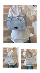Detail of light blue faux leather multi-functional bag showing silver hardware and straps