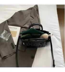 Interior view of black pebbled leather tote showing ample space for a tablet and umbrella