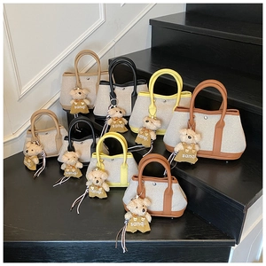 Contrast stitching canvas bucket bags in four colors with cute bear charms on steps