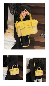 Detailed view of yellow and beige contrast bag in leather and canvas multi-wear styles