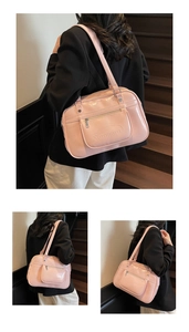 Detail view of pink PU leather JK style shoulder bag featuring Noromoro embossed logo