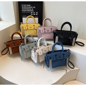 Detailed collection of seven mini color-block tote bags with premium leather and canvas textures