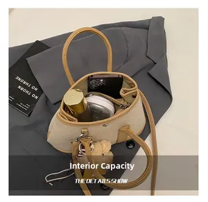 Internal view of the canvas tote bag showing storage for phone, cosmetics, and inner pocket