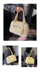 Detail of a creamy yellow leather backpack with embossed Noromoro logo and zip pocket