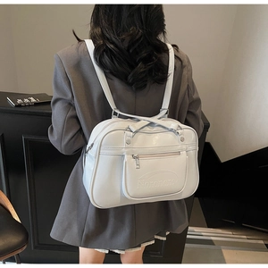 Modern grey faux leather backpack with embossed text shown from a back-view perspective