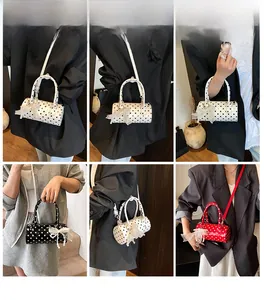 Sweet polka dot cylinder bag shown in six daily wear styles with lace bow details