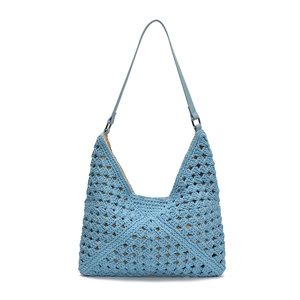 Light blue hollowed-out woven straw tote bag with leather straps for beach vacations
