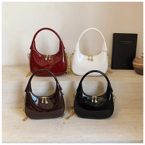Glossy patent leather hobo bags with gold chain straps and sphere zipper detail