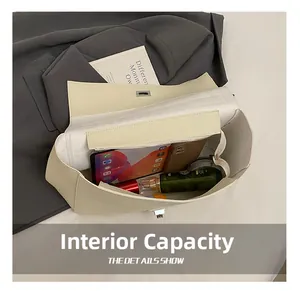 Detail view of the interior capacity showing a tote bag holding two phones and cosmetics
