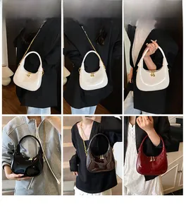 Multiple views of a glossy crescent handbag styled as a crossbody and shoulder bag