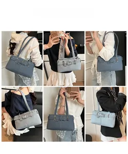 Detailed views of vintage denim shoulder bag with belt buckle and metallic clasp accents