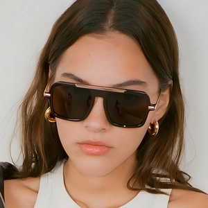 Fashionable square aviator sunglasses with black frames and gold metal accents for women