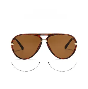Detail view of tortoiseshell aviator sunglasses with brown lenses and metal double bridge